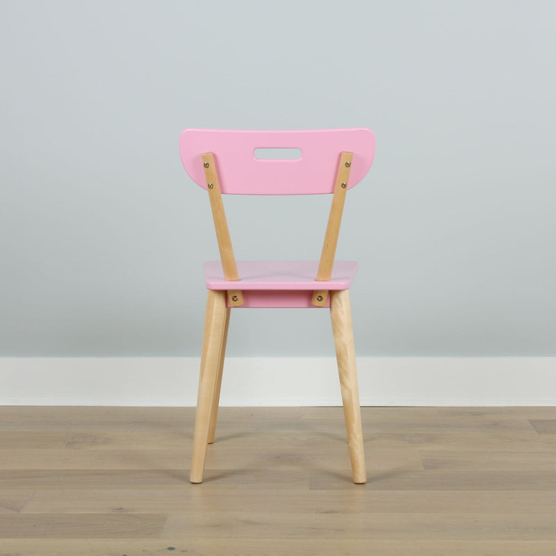 Pink modern wooden chair with natural wood legs, back view against pale blue wall on light hardwood floor