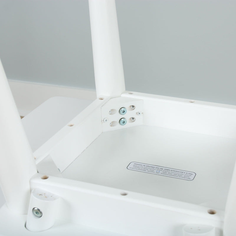Close-up of a white chair underside showing metal screws and a mounting bracket on a white plastic frame