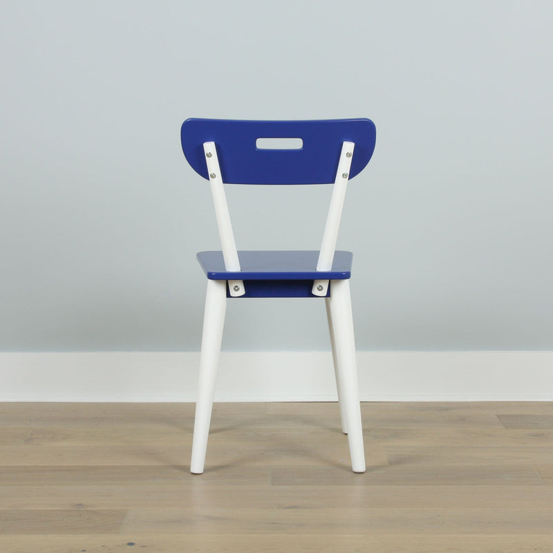 Blue and white modern dining chair back view against a light gray wall on hardwood floor, minimalist interior seating