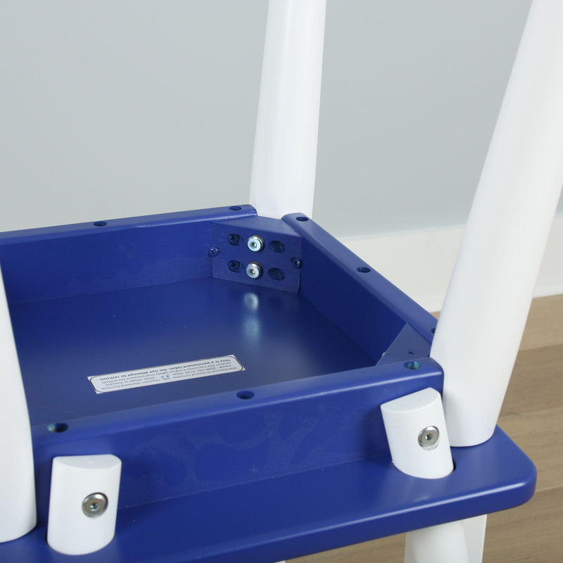 Close-up of blue plastic children's chair underside with white legs and visible metal screws and bolts, assembly detail