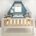 Cozy attic bedroom with teal blue accent wall, white wooden bed frame with natural wood slats, matching wood nightstands, bamboo blinds and bedside lamp
