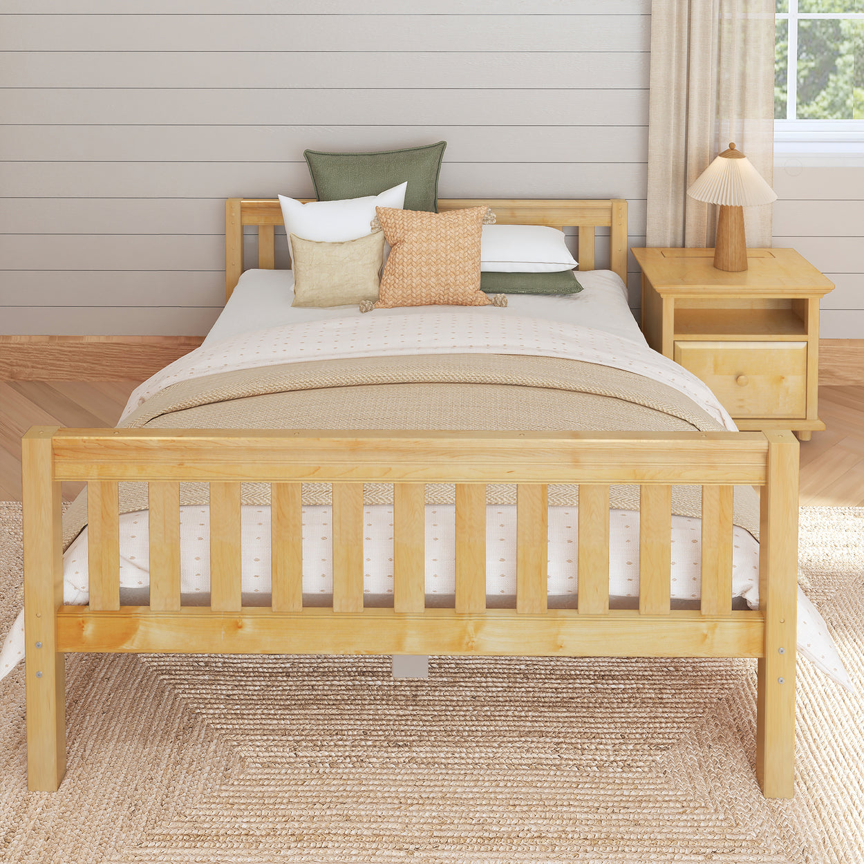 Wooden bed frame with neutral bedding and decorative pillows in cozy bedroom setting.