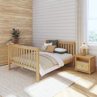 Cozy bedroom with wooden furniture, including a bed, nightstand, and dresser, featuring neutral decor and natural light.