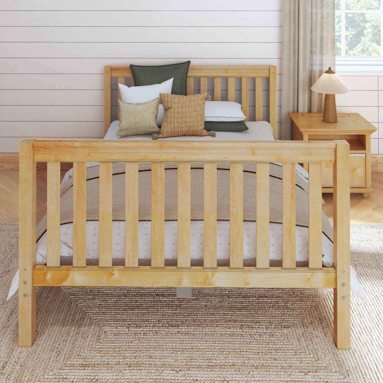 Wooden bed with natural finish and decorative pillows, in a modern bedroom setting featuring a matching nightstand and stylish lamp.