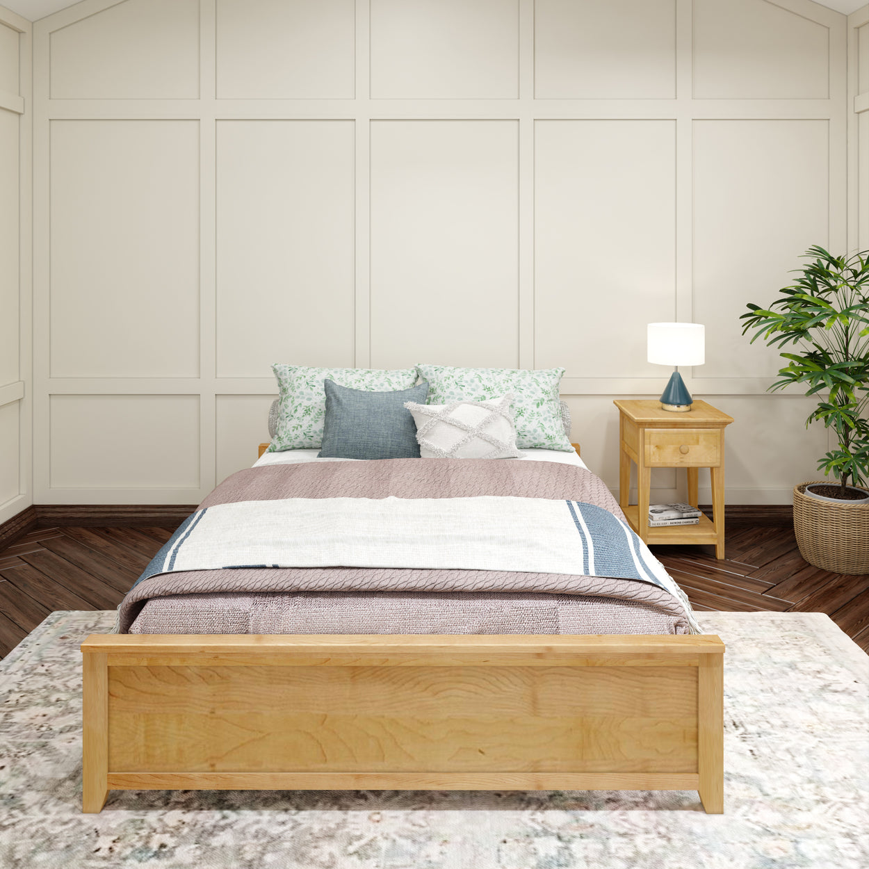 Cozy bedroom with wooden bed frame, patterned pillows, side table, and modern lamp in a serene setting.