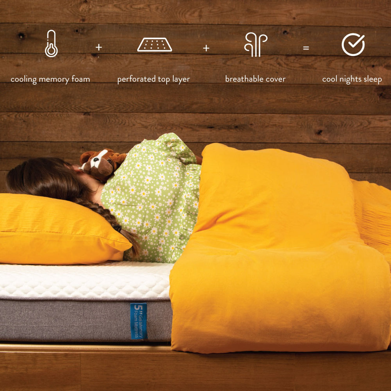 Child sleeping on a cooling memory foam mattress with a perforated top layer and breathable cover for a restful night.