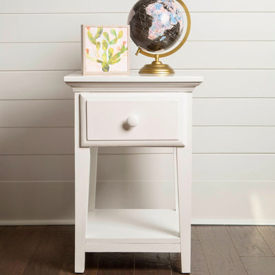White wooden side table with drawer, featuring a decorative globe and a small cactus-themed wall art, set against a shiplap background, ideal for modern home decor.