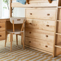 Light maple loft bed with built-in desk, white chair and multi-drawer dresser — Scandinavian kids bedroom furniture
