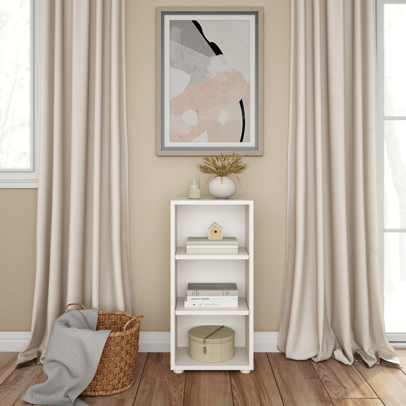 Modern minimalist living room with white shelving unit and abstract artwork.