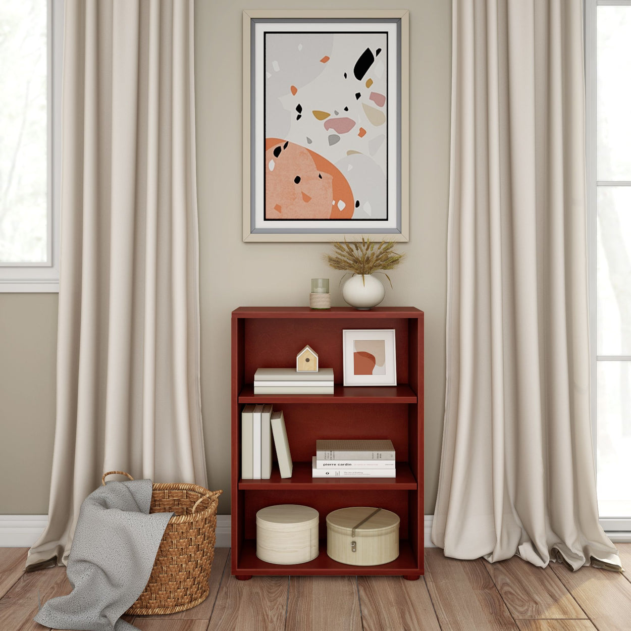 Modern living room interior with minimalist bookshelf, abstract wall art, and decorative plants.