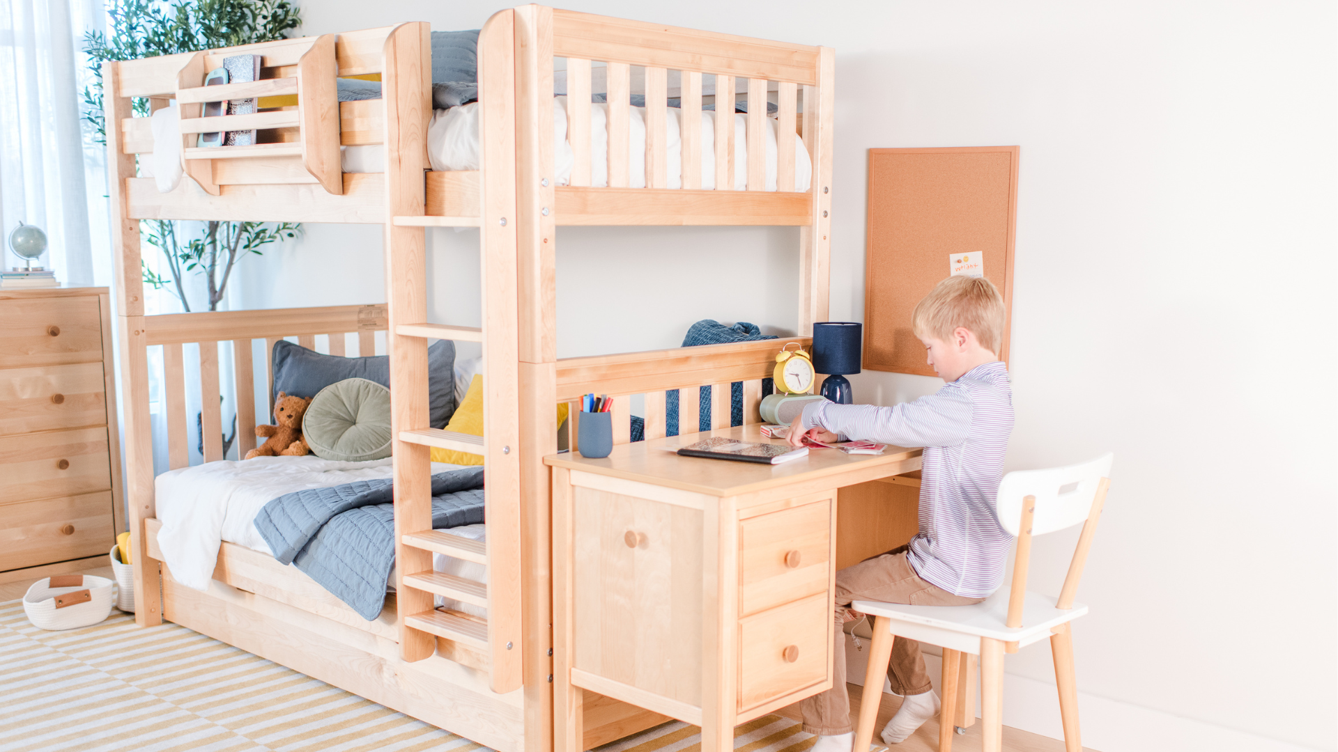 Children's room with bunk bed, floral wallpaper, and toys.