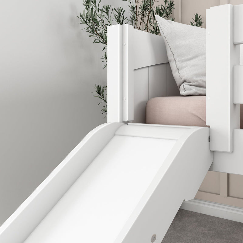 White wooden indoor play slide attached to a children's bunk bed with pink mattress and white pillow in a modern neutral kids' bedroom nursery