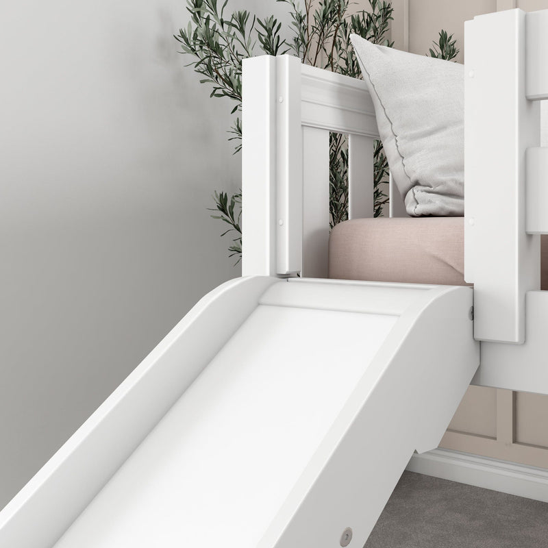 White wooden indoor slide attached to a bunk bed with blush pink mattress and textured pillow, modern kids bedroom decor with greenery