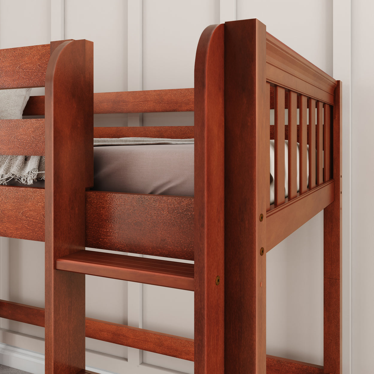 Wooden bunk bed with a rich brown finish and safety rails against a white wall background.