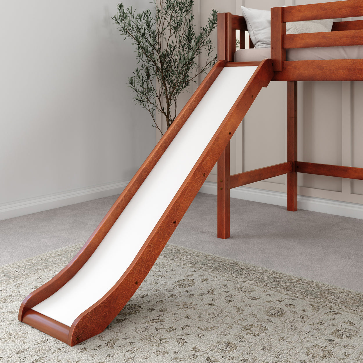 Loft bed with slide in a child's room, featuring wooden frame and carpet flooring.