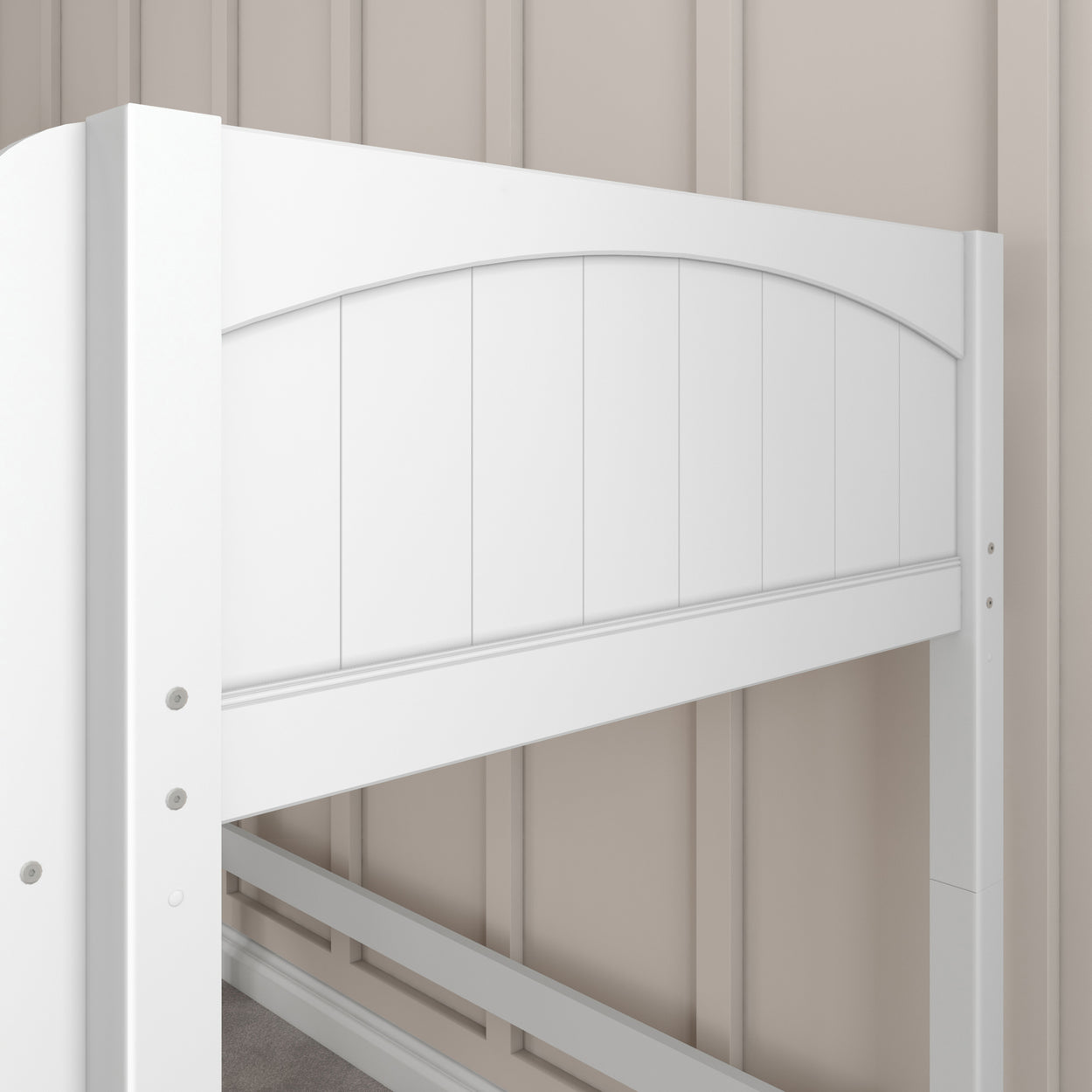 White wooden bed frame design against a beige paneled wall.