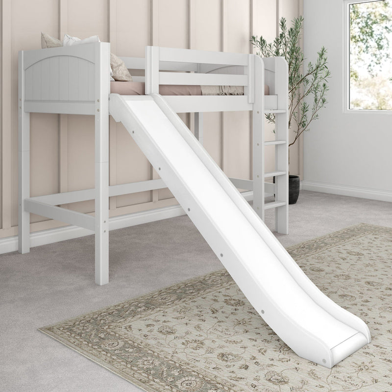 White wooden loft bed with slide and ladder in a neutral modern kids' bedroom, pink bedding, patterned rug and potted plant