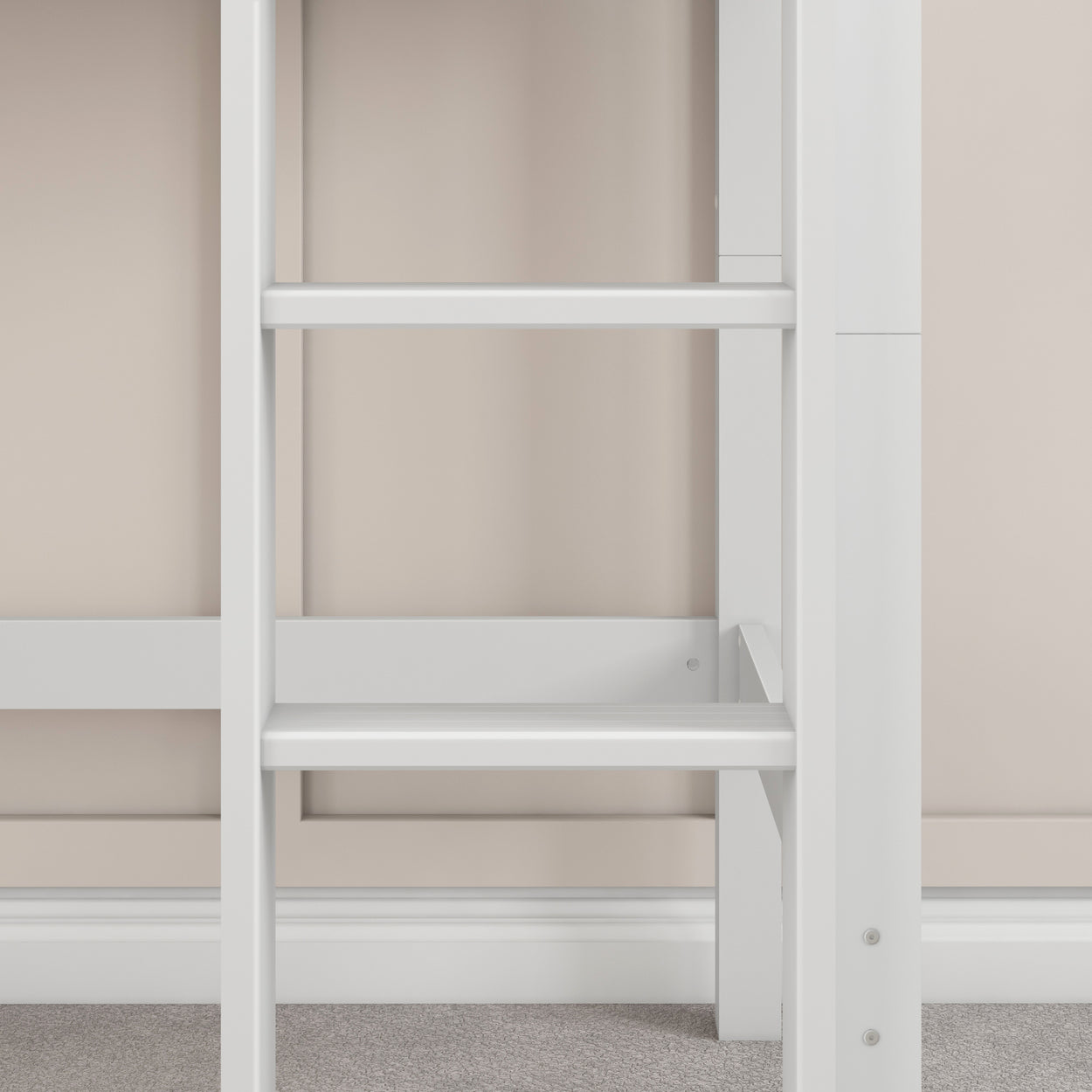 White wooden loft bed ladder against beige wall background.