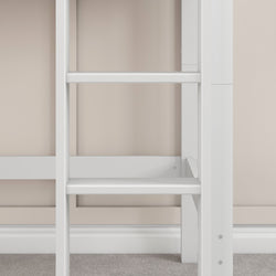 White wooden loft bed ladder against beige wall background.