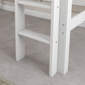 White wooden bunk bed ladder and side rails close-up on gray carpeted bedroom floor