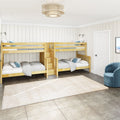 Modern kids bedroom with natural wood twin-over-twin bunk beds, white shiplap walls, beige rug and blue accent pillows
