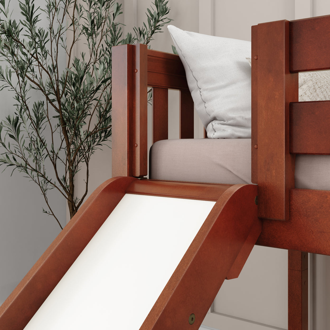 Wooden loft bed with slide and decorative green plant, kid’s room interior design.