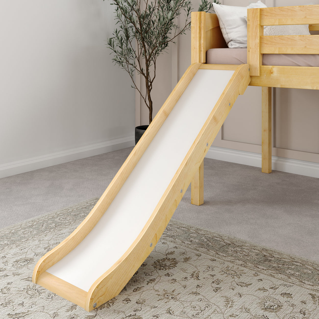 Children's wooden loft bed with slide and cozy cushions in modern bedroom.