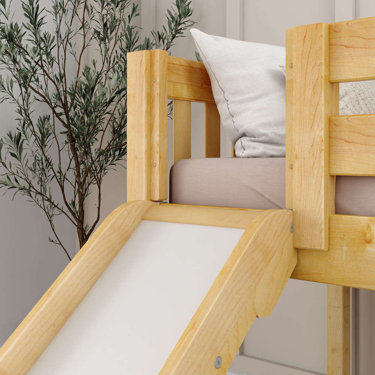 Wooden loft bed with built-in slide and cozy throw pillows, perfect for children's bedroom design.
