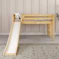 Natural wood loft bed with slide in a modern neutral kids' bedroom, beige paneled wall, decorative pillows and patterned rug