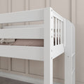 White wooden bunk bed with safety guardrail and ladder in a modern kids bedroom against a beige paneled wall