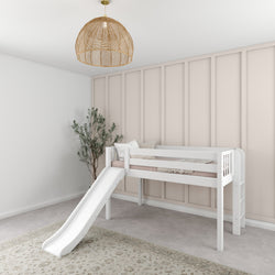 Children's white loft bed with slide in modern kids' room featuring beige accent wall and wicker pendant light.