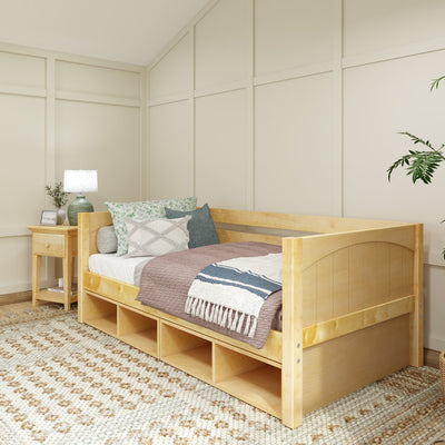 Wooden daybed with storage and cozy pillows in a modern bedroom setting.