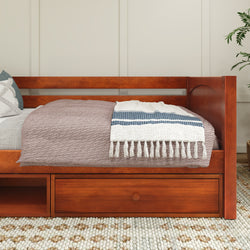 Wooden daybed with storage drawers, covered in cozy bedding and a decorative patterned blanket in a modern bedroom setting.