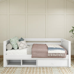 White daybed with storage, featuring decorative pillows and a cozy blanket, in a modern bedroom setting.