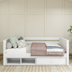 Modern white daybed with storage drawers and decorative pillows in a cozy bedroom setting.