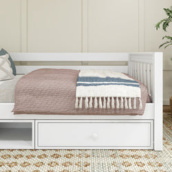 White wooden daybed with storage drawers, beige and blue striped throw blanket, and cozy decor in modern bedroom.