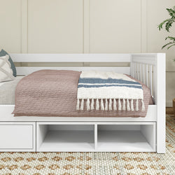 White daybed with storage drawers and cozy bedding in a modern bedroom setting.