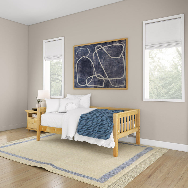 Modern bedroom with light wood bed, white bedding, chunky blue knit throw, wooden nightstand, abstract wall art, two windows.
