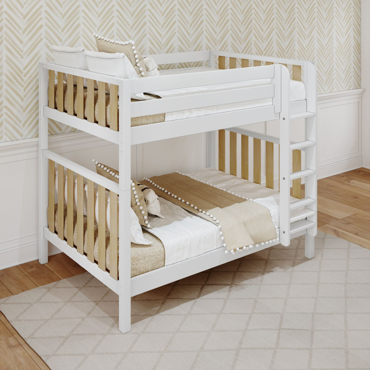 White wooden bunk bed with beige bedding in a modern bedroom featuring chevron wallpaper and hardwood flooring.