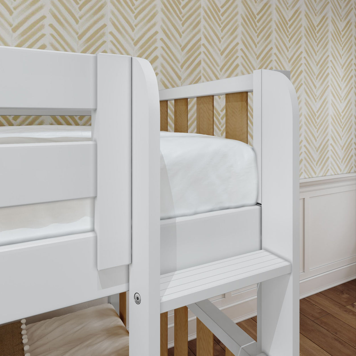 White wooden toddler bunk bed with a chevron patterned yellow wallpaper background in a cozy room.