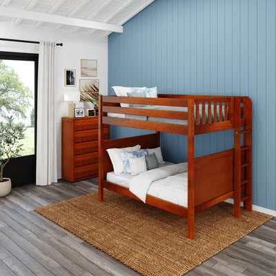 Wooden bunk bed in a modern bedroom with blue accent wall and natural light.