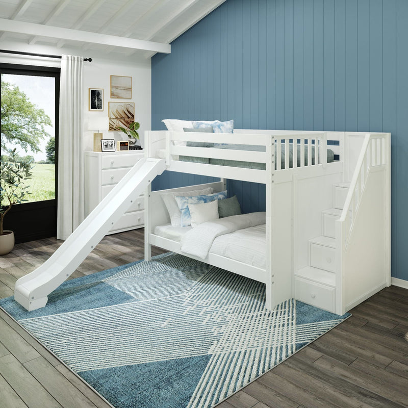 White kids bunk bed with slide and built-in storage stairs in a modern children's bedroom with blue vertical shiplap accent wall, white dresser, window view and patterned blue area rug