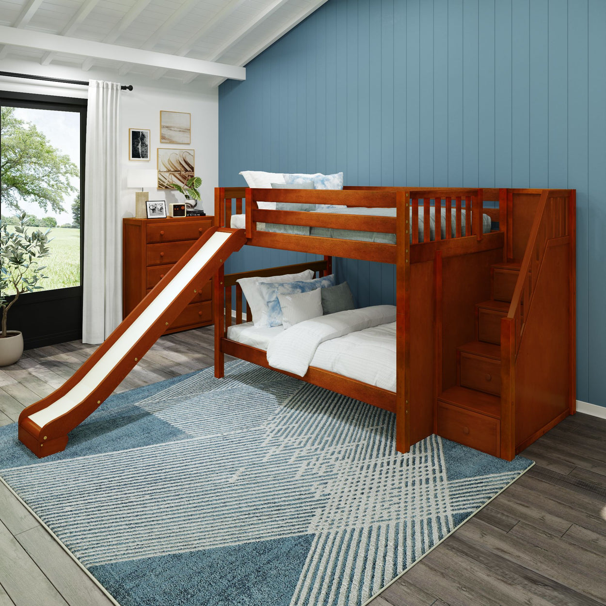 Bunk bed with slide in modern kids' room featuring blue wall and rug.