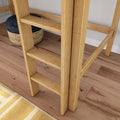 Close-up of light wooden bunk bed ladder on oak hardwood floor with woven black-and-natural storage basket and yellow striped rug
