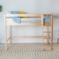 Natural light wood twin loft bed with ladder, blue bedding and yellow accent pillow in minimalist kids bedroom