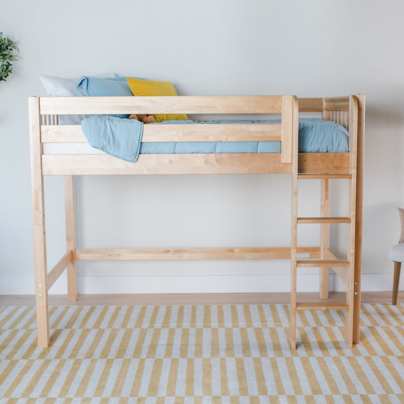 Natural light wood twin loft bed with ladder, blue bedding and yellow accent pillow in minimalist kids bedroom