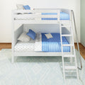 White wooden twin bunk bed with blue quilted bedding, star-pattern sheets and pillows, built-in ladder and chrome handrail in a modern kids' bedroom