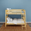 Natural light-wood twin-over-full bunk bed with ladder, gray-blue bedding and pillows against a blue paneled wall in a cozy kids' bedroom