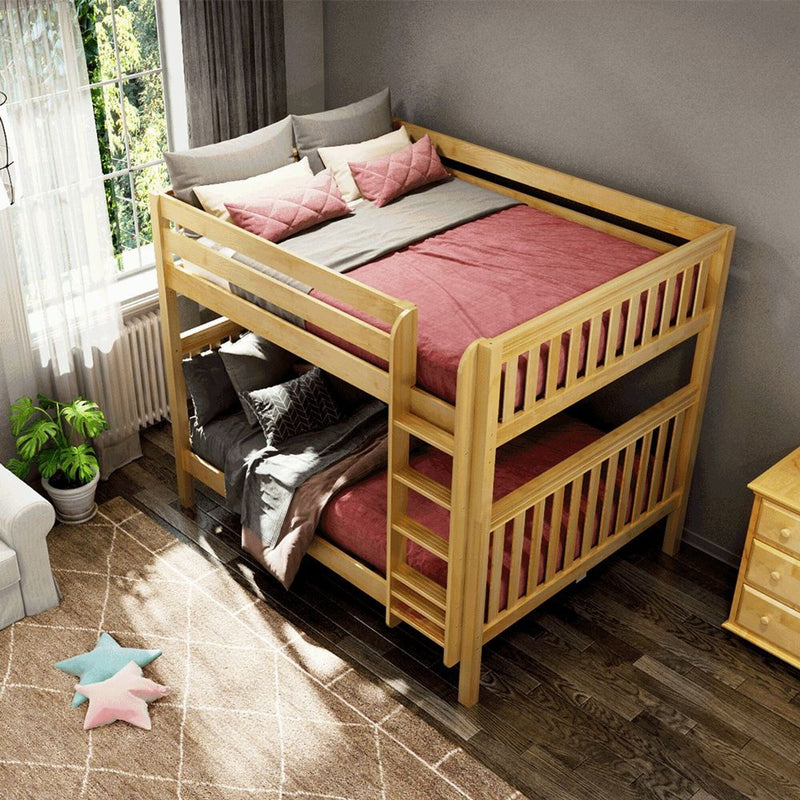 Wooden twin-over-twin bunk bed with pink quilt and gray pillows in a bright children's bedroom with window, rug and potted plant