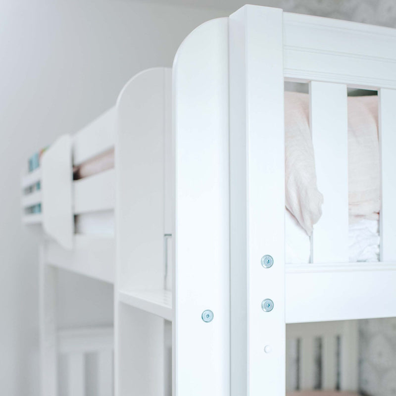 Close-up of white wooden bunk bed safety rail and slats with visible screws and soft pink bedding in a modern nursery